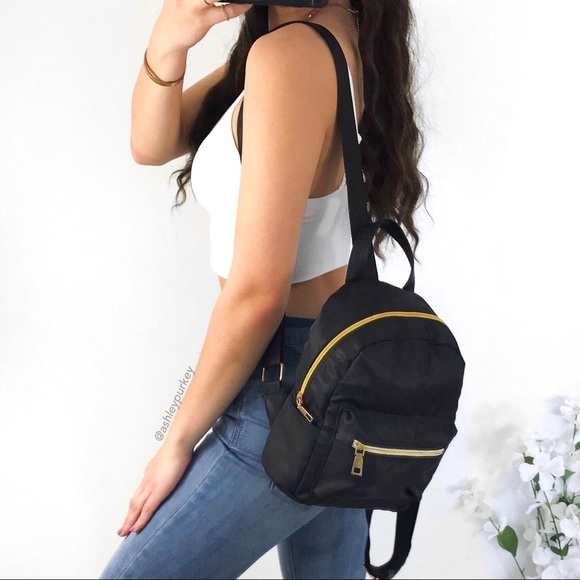 Daisys Boutique Handbags - ❤️SALE❤️ Black and gold mini backpack